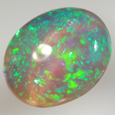 SOLID CRYSTAL OPAL Bright sparkles of greens throughout a purple hue